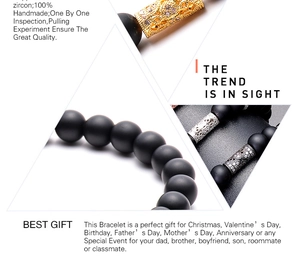 Detailed macro view of handmade matte black beads with zircon-inlaid gold and silver cylinders