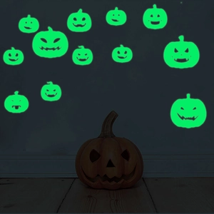 Luminous Halloween pumpkin stickers glowing in dark for festive interior decoration