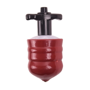 Close-up of a red and black musical light-up spinning top with smooth plastic texture