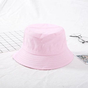 Detail of pink cotton bucket hat with parallel stitching on the brim and soft texture