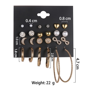 9-pair gold alloy earring set with moon, stars, pearls, and hoops of various sizes