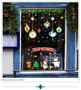 Detail view of cartoon Santa train window stickers with Merry Christmas text on glass