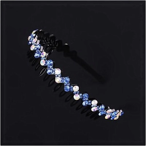 Close-up of wavy non-slip headband with sparkling blue and iridescent rhinestones