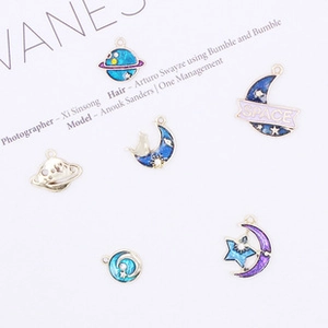 Detailed view of 6-piece starry sky enamel charms featuring moon, stars and space themes