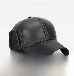 Detail view of winter baseball cap with faux leather finish and warm earflaps