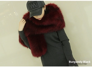 Detailed view of wine red faux fox fur shawl with black tips for evening dresses