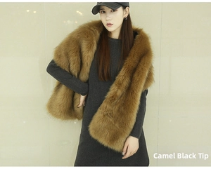 Macro view of luxurious camel faux fox fur shawl with stylish black tips for evening dresses