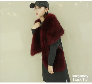 Detailed texture of burgundy faux fox fur shawl with elegant black tips for evening wear