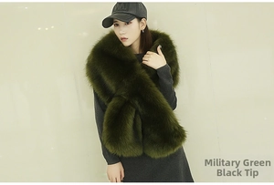 Detail of army green faux fur stole with black tips shown on a model's neck