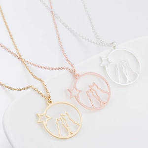 Minimalist origami cat and star pendant necklaces in gold, silver, and rose gold finishes