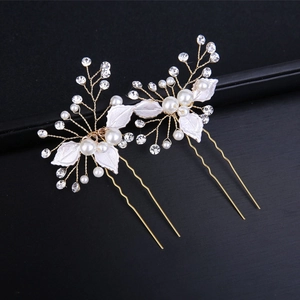 Handmade bridal hair pins with gold branches, white leaves and pearls for wedding hairstyles