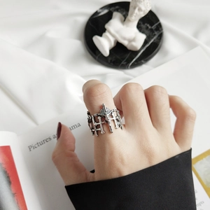 Detail of vintage 925 sterling silver cross ring with an antique embossed texture