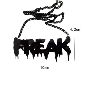 Detail view of black ZOMBIE style FREAK letter necklace showing 10cm by 4.2cm dimensions