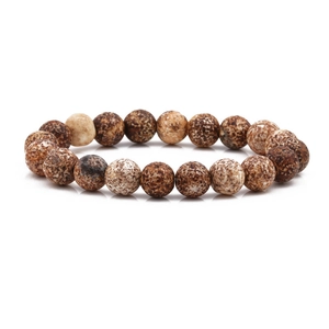 Macro detail of 10mm natural map stone beads with unique mineral texture on elastic bracelet