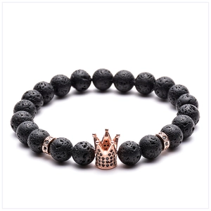 Close-up of 8mm black lava stone beads with rose gold micro-pave zircon crown detail