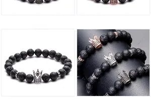 Macro detail of 8mm black lava stone beads and micro-pave crown charm on bracelet