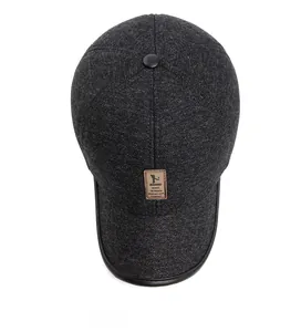 Detailed top view of grey winter baseball cap featuring leather brim and brand patch