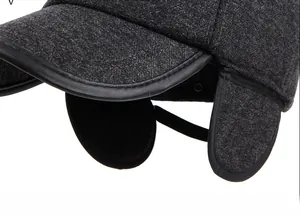 Close-up of winter baseball cap with thick wool texture and fold-down ear protection