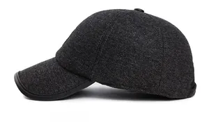 Detail shot of men's winter wool baseball cap with gray twill fabric and leather-trimmed brim