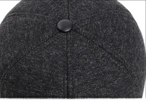Close-up of a men's winter baseball cap showing neat stitching and wool texture