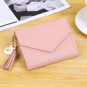 Pink faux leather envelope wallet for women with heart pendant and fringe tassel detail