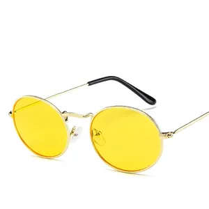 Vintage oval sunglasses with gold metal frame and yellow lenses for a retro fashion look