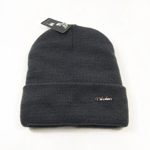 Solid charcoal grey winter beanie hat with metal brand logo and ribbed knit texture