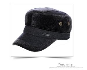Detail view of winter faux fur flat top hat with metal buttons and stitched jeans label