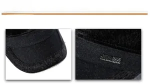 Detail of winter flat top cap featuring thick wool fabric and faux fur earflaps