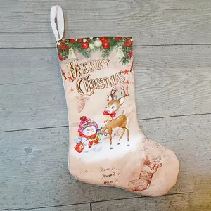 Vintage beige Christmas stocking with snowman elk prints and Merry Christmas text