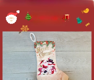 Detail of Christmas stocking featuring Santa Claus and Snowman with Merry Christmas text