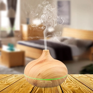 Macro view of wood grain ultrasonic diffuser with mist and LED light control buttons