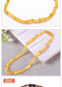 Detailed comparison of blood amber and golden amber beads on a natural wooden background