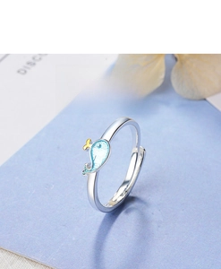 Macro view of blue whale dolphin ring with S925 silver band and enamel tail detail