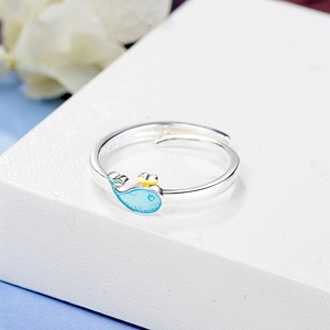 Adjustable S925 sterling silver ring with blue whale design on a white display stand