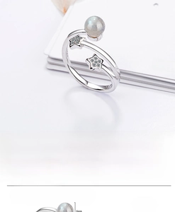 Close-up of S925 sterling silver star ring featuring moonstone bead and zircon stars