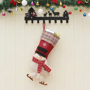 Christmas stocking with 3D skiing snowman on red velvet and plaid trim for holiday decor