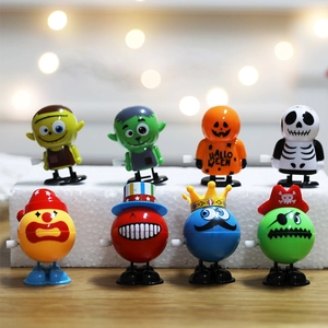 8 pack wind-up Halloween toys featuring Frankenstein and pumpkin on wooden desk