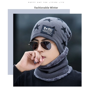 Close-up of gray knit beanie and neck warmer set with star pattern and fleece lining