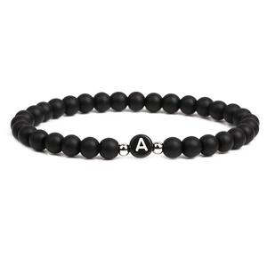 Black matte 6mm stone bead bracelet featuring letter A charm and silver spacers