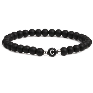 Black matte stone beaded bracelet with silver accent beads and letter C center bead