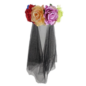 Detail of colorful artificial roses and black mesh veil on a festive Halloween headband