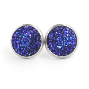 Detail shot of 12mm silver stud earrings with blue sparkling druzy crystals on white base