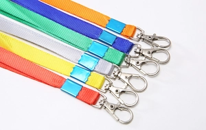 Macro detail of multi-colored nylon lanyards with rotating metal lobster clasps