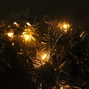 Black PVC Christmas wreath with warm LED lights for holiday window decoration