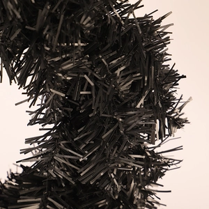 Close-up of black PVC Halloween Christmas garland with dense shiny metallic texture