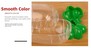 Detail of creative carrot candy box showing the green lid and clear plastic seal