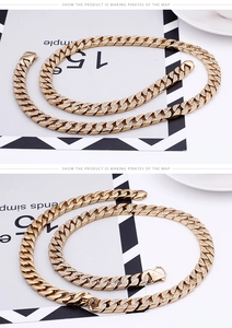 Close-up of gold-plated hip-hop Cuban link chain necklace with sparkling rhinestones