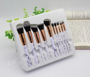 Close-up of 10pcs marble pattern makeup brushes with rose gold metal ferrules and soft bristles