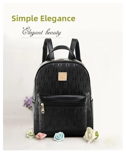 Elegant beauty close-up of black embossed PU leather backpack with gold hardware zipper